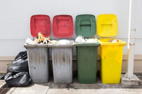 Residents arranging furniture for disposal in Bermondsey